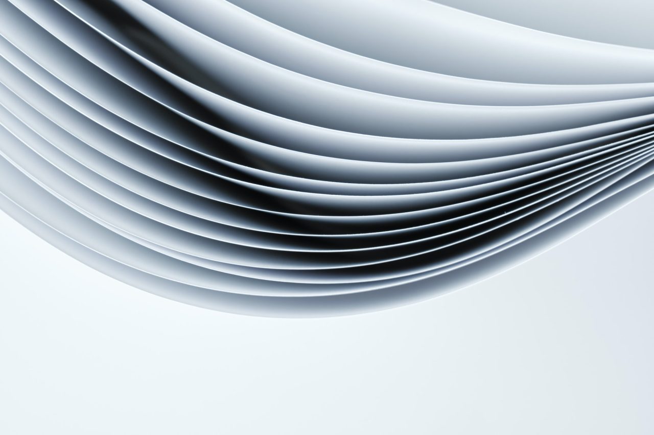 abstract background sheets of paper forming a pattern of curved lines